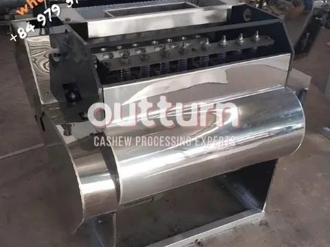OUTTURN 10-head cashew nut cutting machine with ten rotary cutting cups on a steel frame