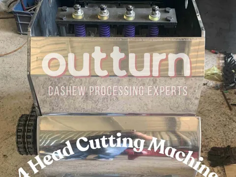 OUTTURN 4-head cashew nut cutting machine with four rotary cutting stations on a steel frame