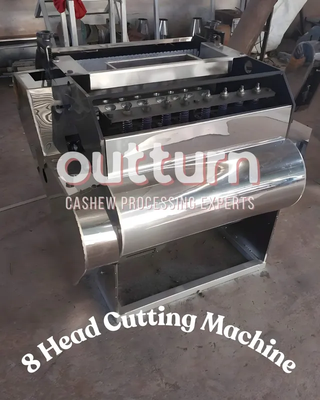 OUTTURN 8-head cashew nut cutting machine showing eight rotary cutting cups arranged around the central turret